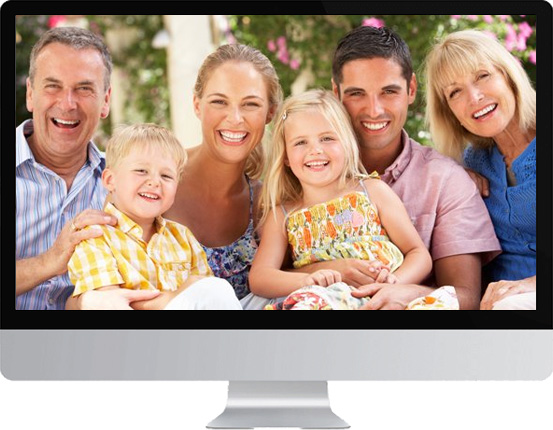 family photo smiling on a computer monitor
